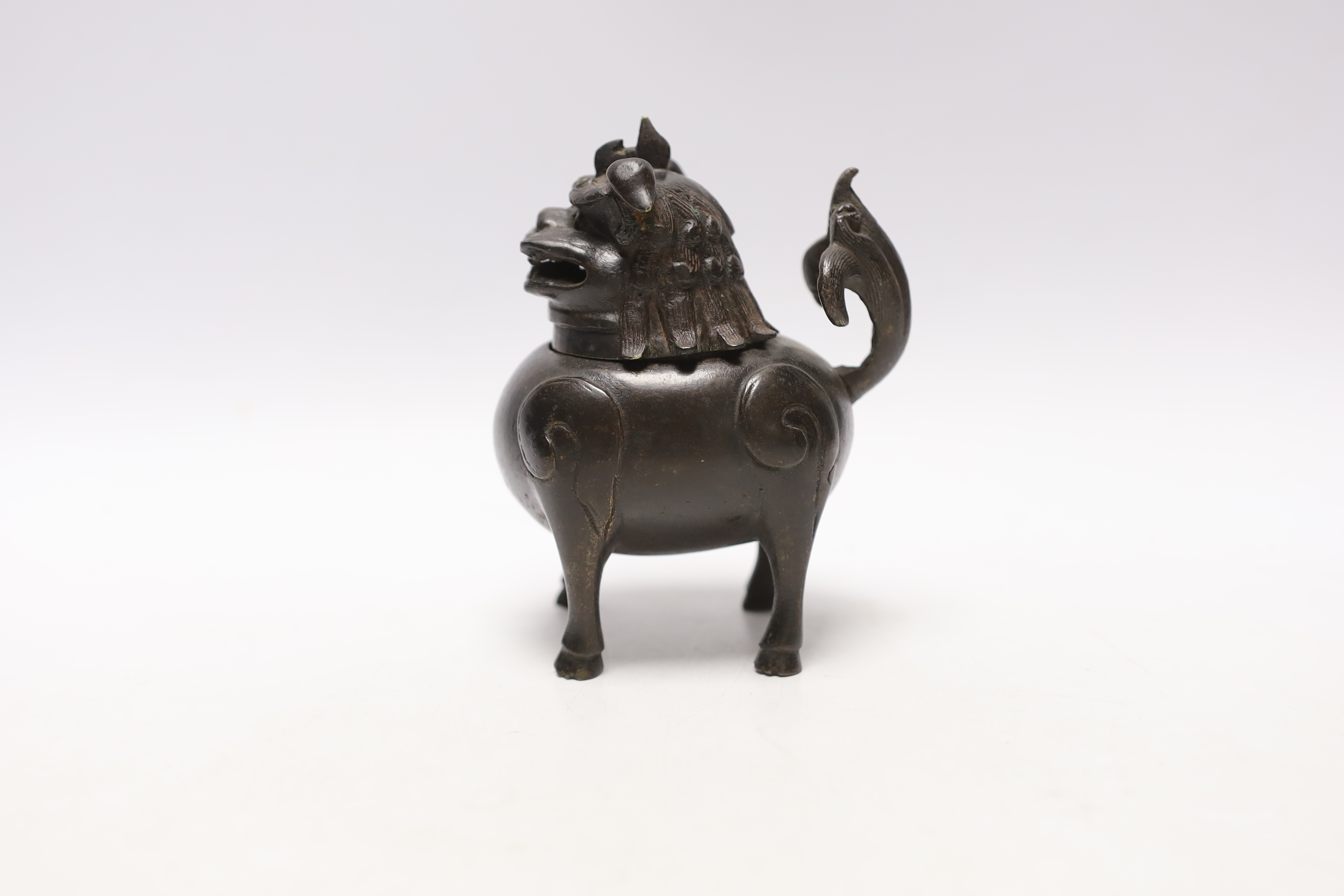 A Chinese bronze mythical beast censer and cover (Luduan), 17th century, the cover with pierced mouth, 9cm in length